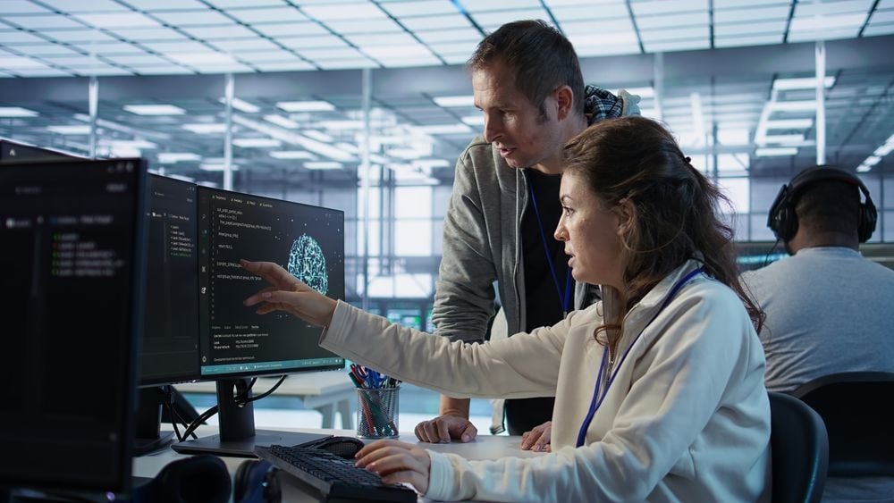 Two ML engineers coding a ml solution