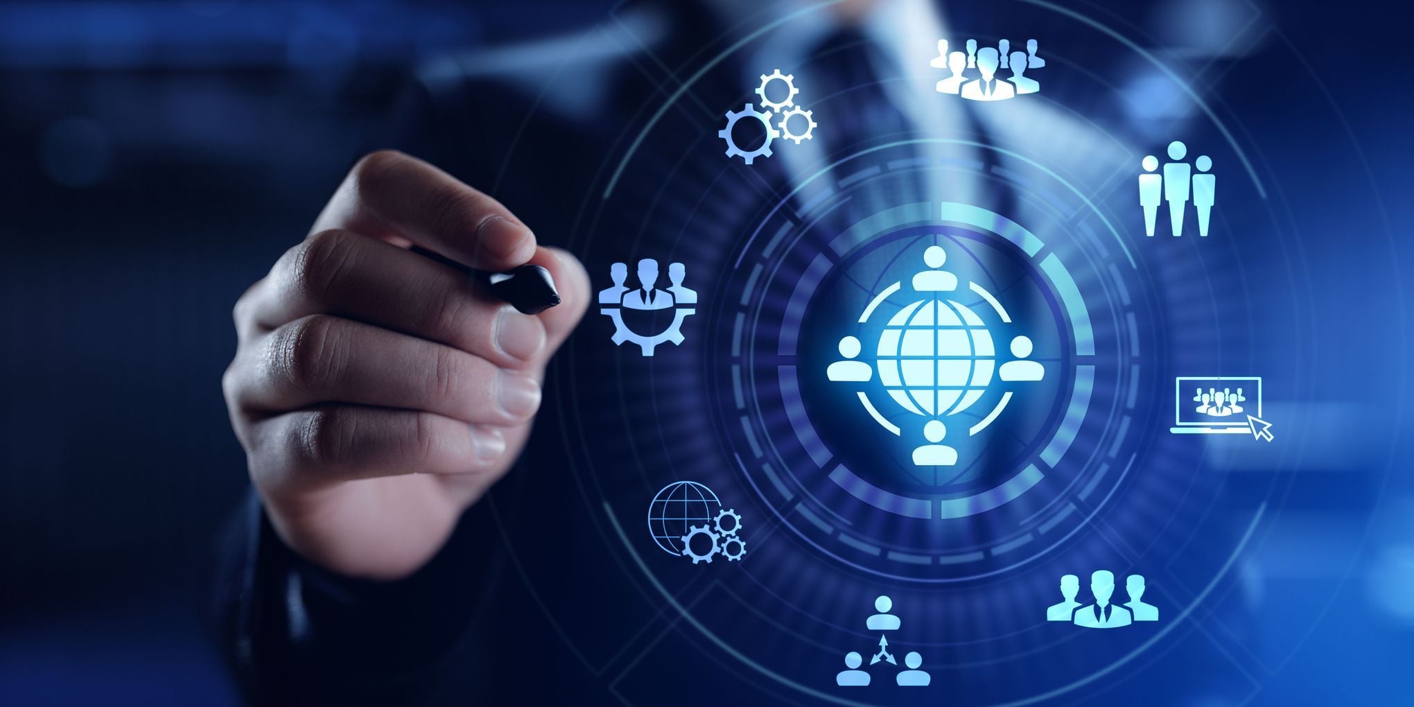 A person interacts with a glowing blue holographic HUD (Heads-Up Display) centered on a globe. Surrounding icons illustrate concepts of remote work, global synchronization, and project management.