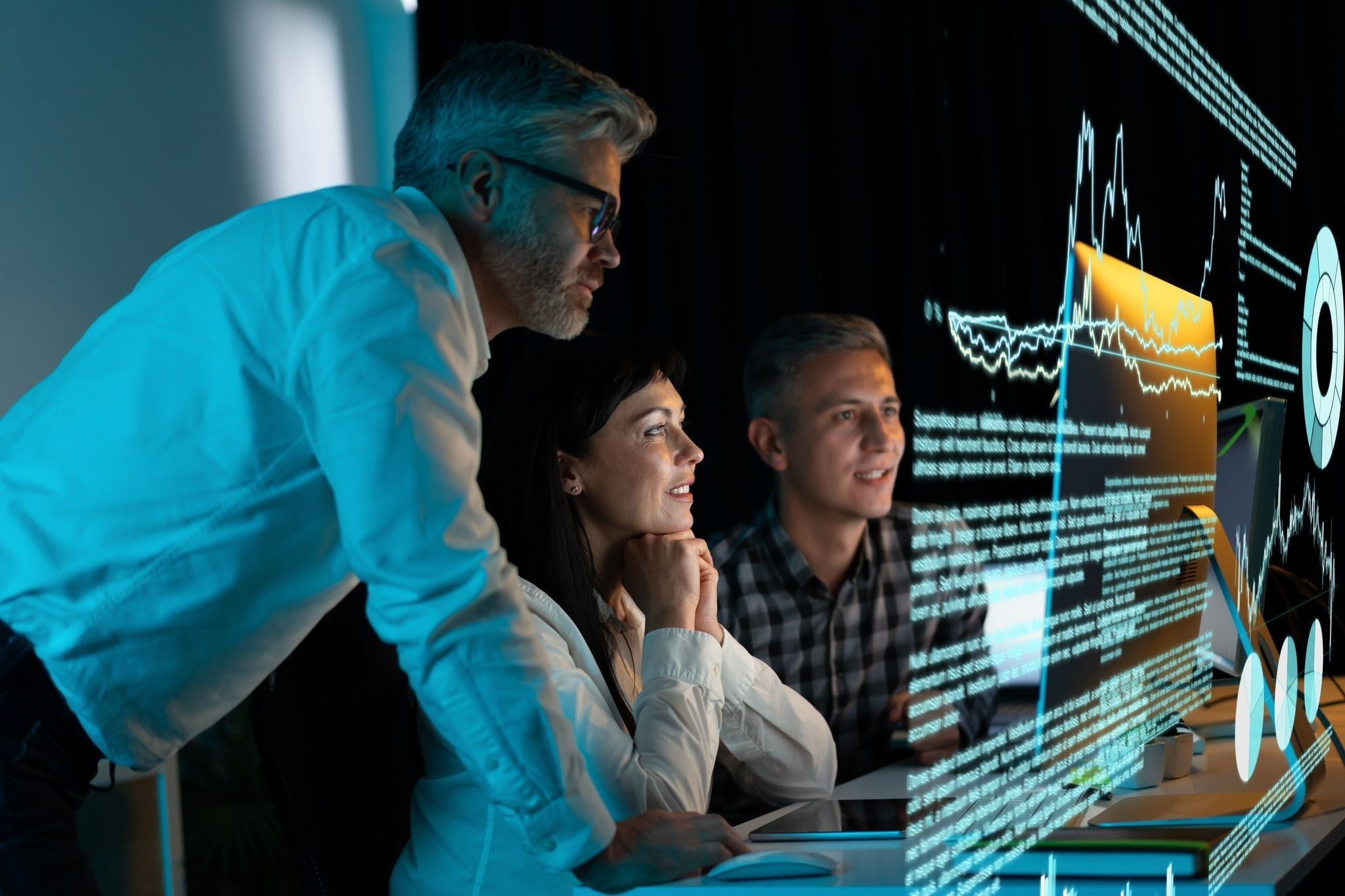 Software engineers collaborating on custom code to develop and fine-tune autonomous AI agents for complex business automation.