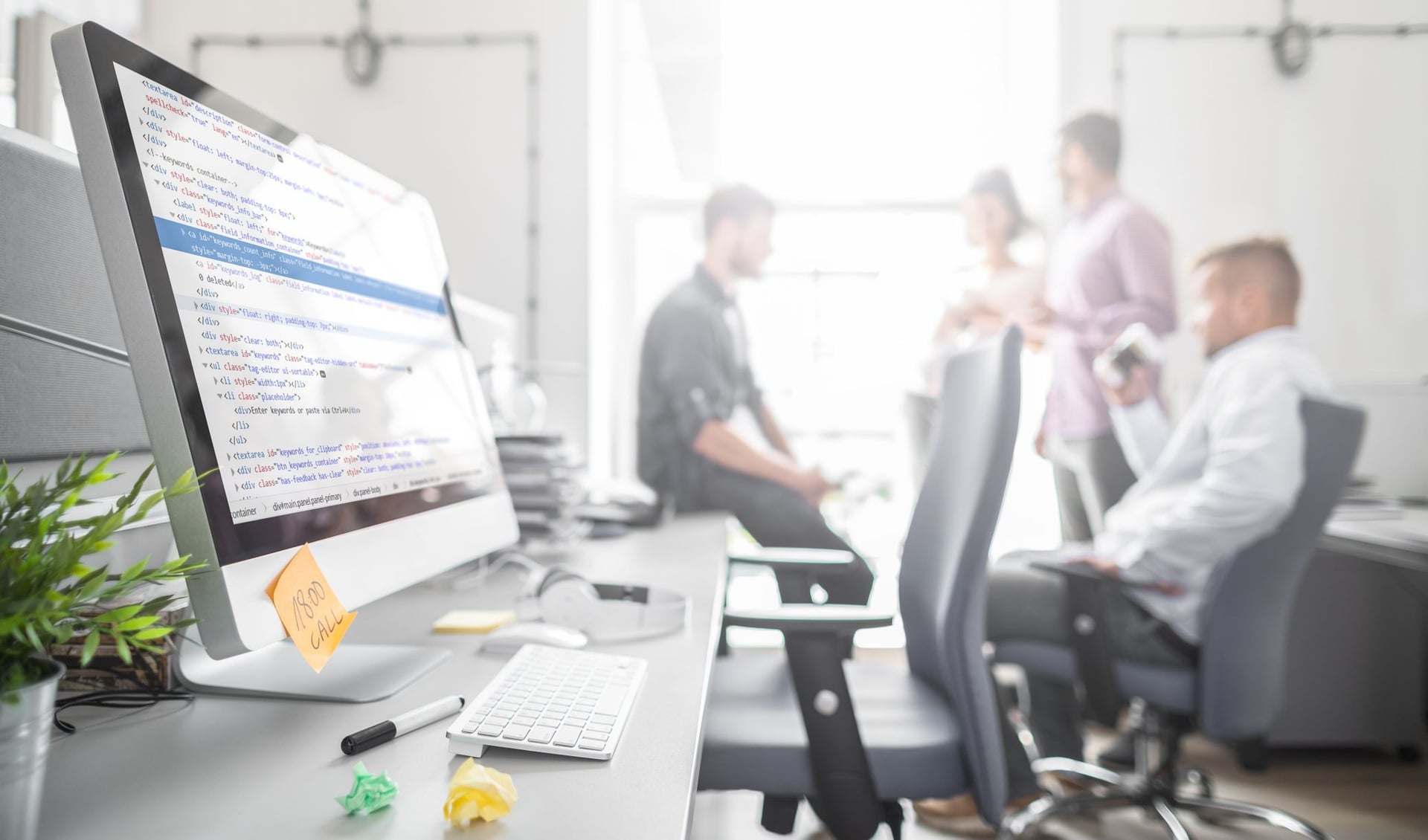 Group of software engineers working together to find an optimal solution